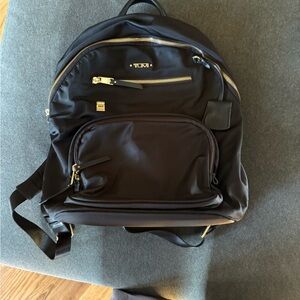 Tumi Black and Gold Backpack